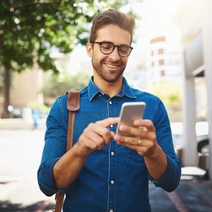 Man using phone for mobile banking